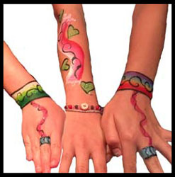 Kids get jewelry body painting on hands at birthday party in Long Island NY