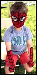 Boy gets spiderman body and face painting with spider webs at kids party Westchester NY
