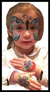 Girl gets butterfly face painting and hands body painted at birthday party Queens NYC