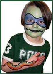 Boy chose facepainting as ninja turtle and body painting with big snake at kids party in Long Island NY