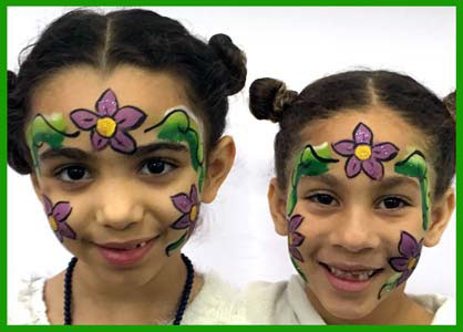 Girls get face painted with flowers at birthday party in Brooklyn NYC