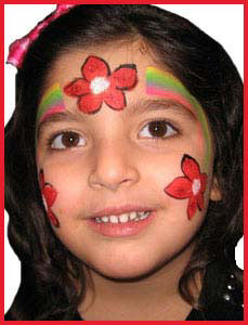 Kid gets holiday flower facepainting at Christmas party in Westchester NY
