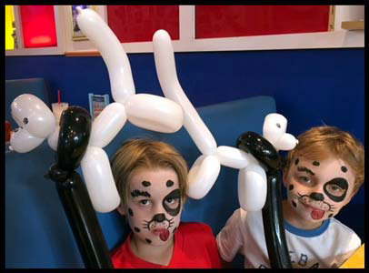 Face painting as dalmations with twisted balloon animals for children's night at Big Daddy's Diner