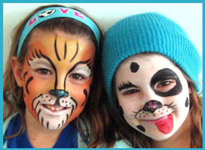 Older kids get facepainting as tiger and dalmatian at company party in Connecticut