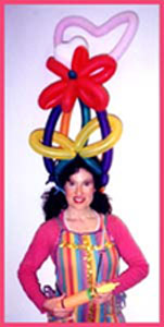 Childrens entertainer Daisy Doodle twisting balloons at a kids birthday party in new york city.