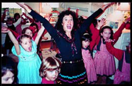 Childrens party entertainer Daisy Doodle teaches dancing at a kids birthday party in nyc