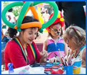 Childrens entertainer Daisy Doodle facepainting at a kids birthday party in new york city.