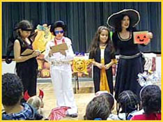 Children at a birthday party in new york city helping with magic for Halloween kids party entertainment 