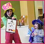 A child helps with a magic trick at a Christmas kids party in nyc