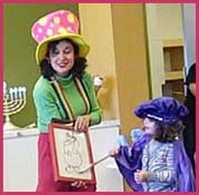 Daisy Doodle performing a magic trick at a holiday kids birthday party in new york city.