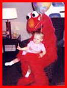 Kids party entertainer Daisy Doodle dresses as Elmo for childrens birthday parties in nyc