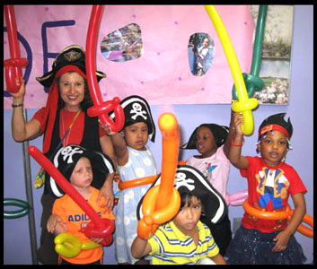 Kids with balloon swords made by Daisy Doodle at pirate birthday party in Brooklyn NY