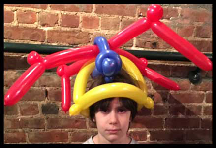 Balloon animals and spider hat twisted by Daisy Doodle for  birthday boy in Westchester NYC
