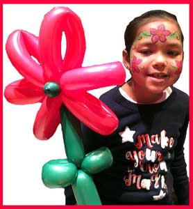 Balloon maker Daisy Doodle twists balloon flowers for birthday parties in Bronx NYC