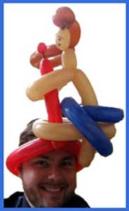 Balloon sculptures includes hats for men at party in Queens NYC
