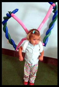 Balloon twisting butterfly wings for little girl's birthday party in Brooklyn nyc
