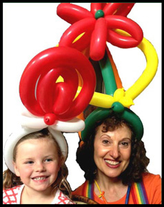 Balloonist Daisy Doodle twisted balloon hats for kids at company party in Brooklyn nyc