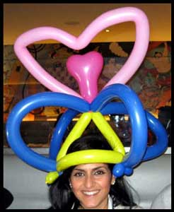 Balloons twisted into hats is popular adult party entertainment in Westchester ny