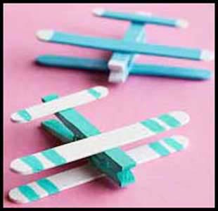 Kids make airplanes from popsicle sticks as birthday party craft project in nyc