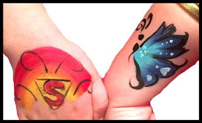 Kid gets body painting on hands as party entertainment in Long Island NY