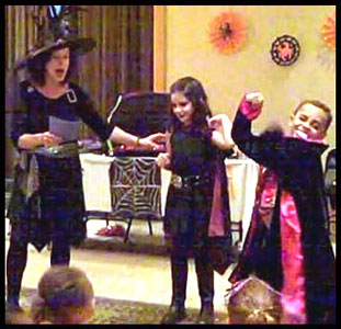 Kids participate in vampire story in Daisy Doodle's halloween magic show nyc