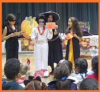 Kids color pumpkins in Daisy Doodle's halloween magic show