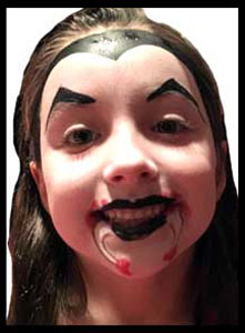 Girl gets facepainted as vampire at kids halloween birthday party in nyc