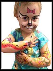 Birthday girl gets arms and face painting at her childrens party in Manhattan NYC