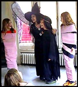 2 girls are wrapped as mummies in Daisy Doodle's Harry Potter magic show in Queens NYC