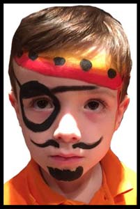 Boy is face painted as a pirate for his birthday party in Queens NY